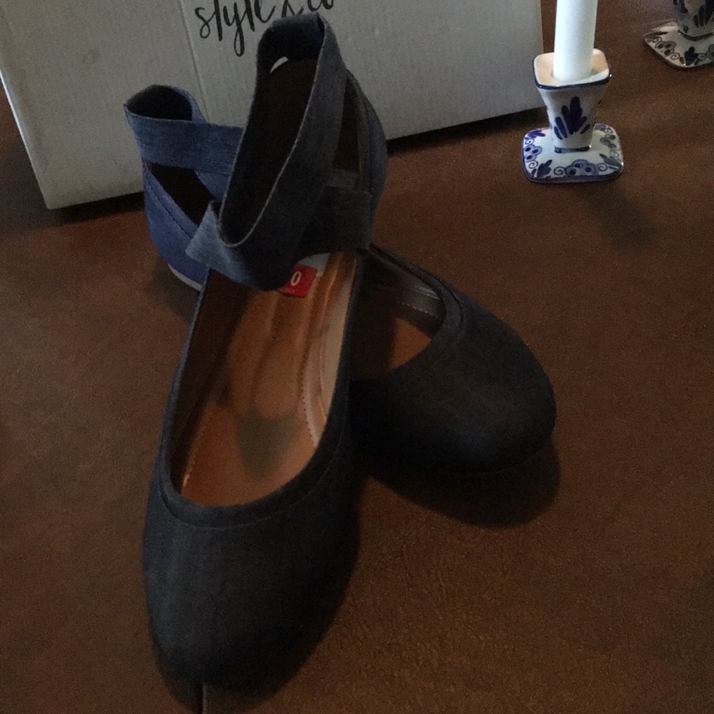 Denim flats with crisscross ankle strap.